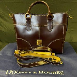 Dooney & Bourke brown handbag with white stitching.  Crossbody strap.